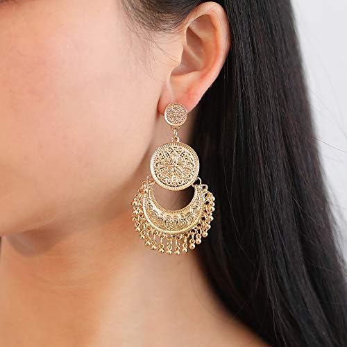 Model wearing the gold earrings